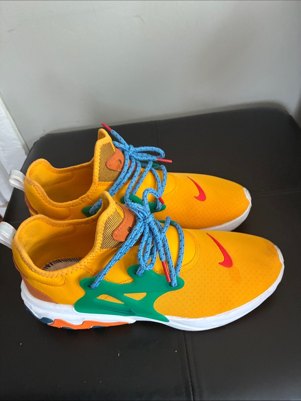 Nike Kids Yellow Sneakers with Blue Laces and Green Accents